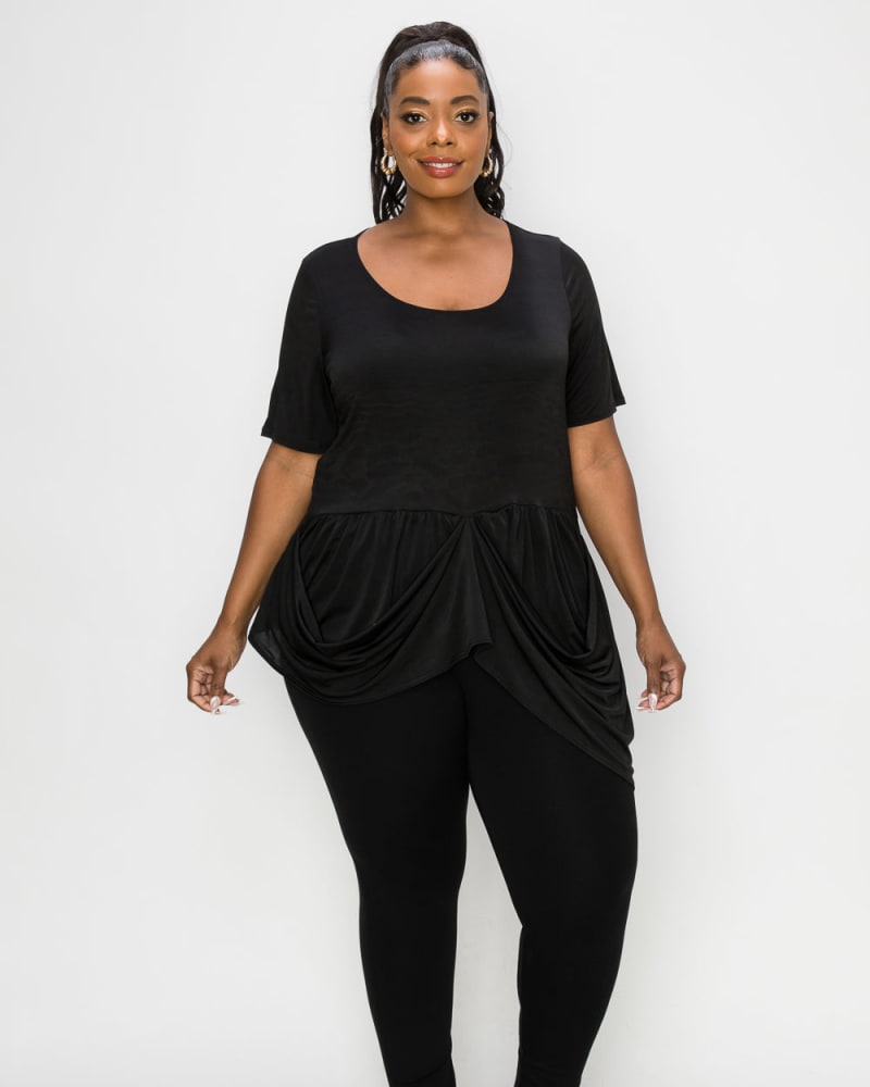 Front of a model wearing a size 1X Savannah Draped Peplum Top in Black by L I V D. | dia_product_style_image_id:241564